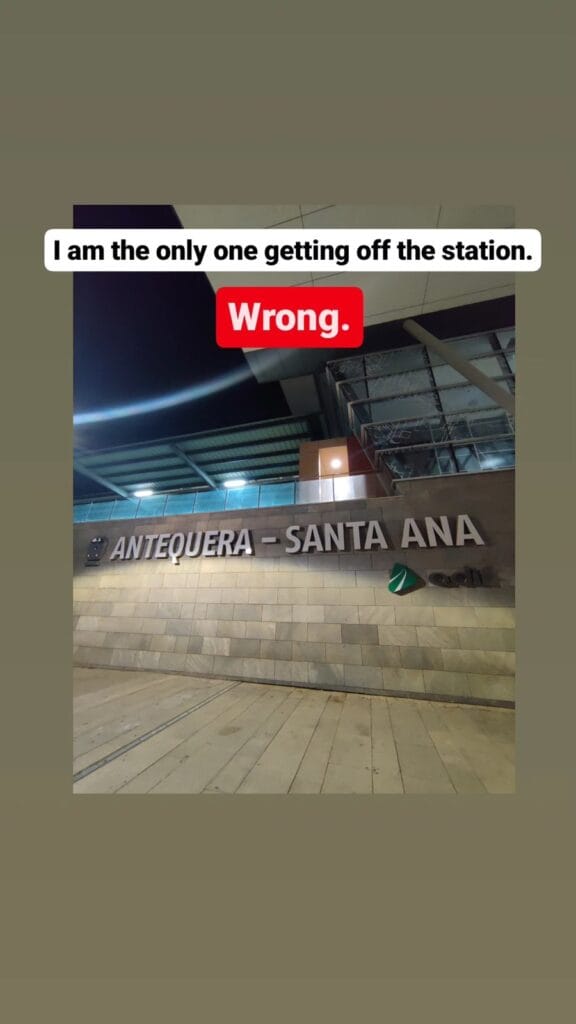Antequera-Santa Ana railway station sign at night, deserted after the last train