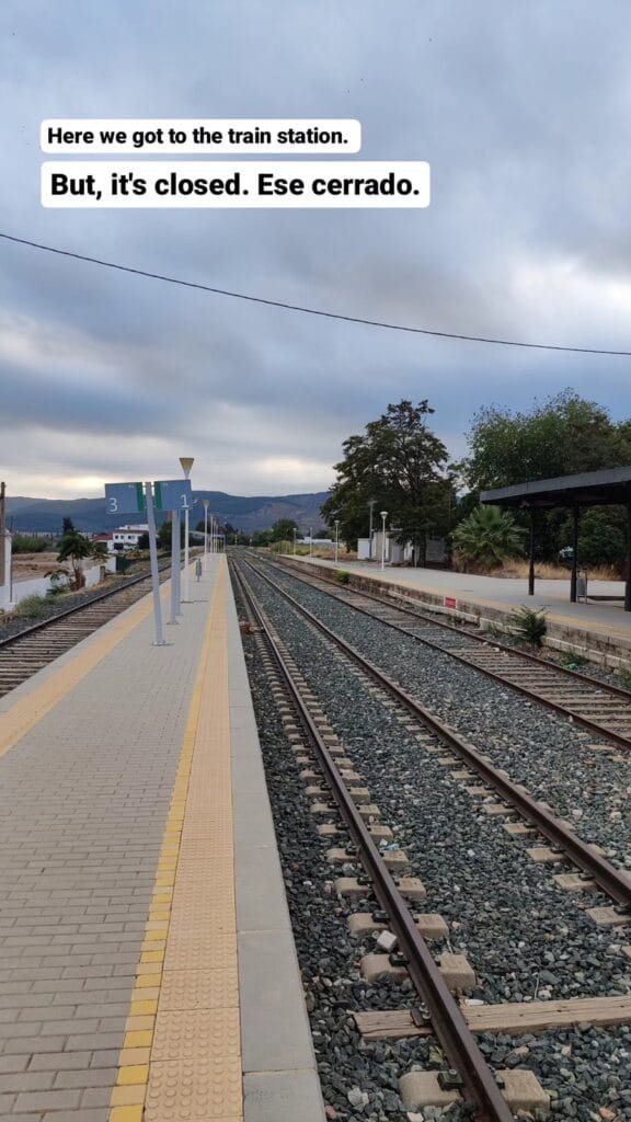 Empty platform at Antequera town station with mountains on the horizon