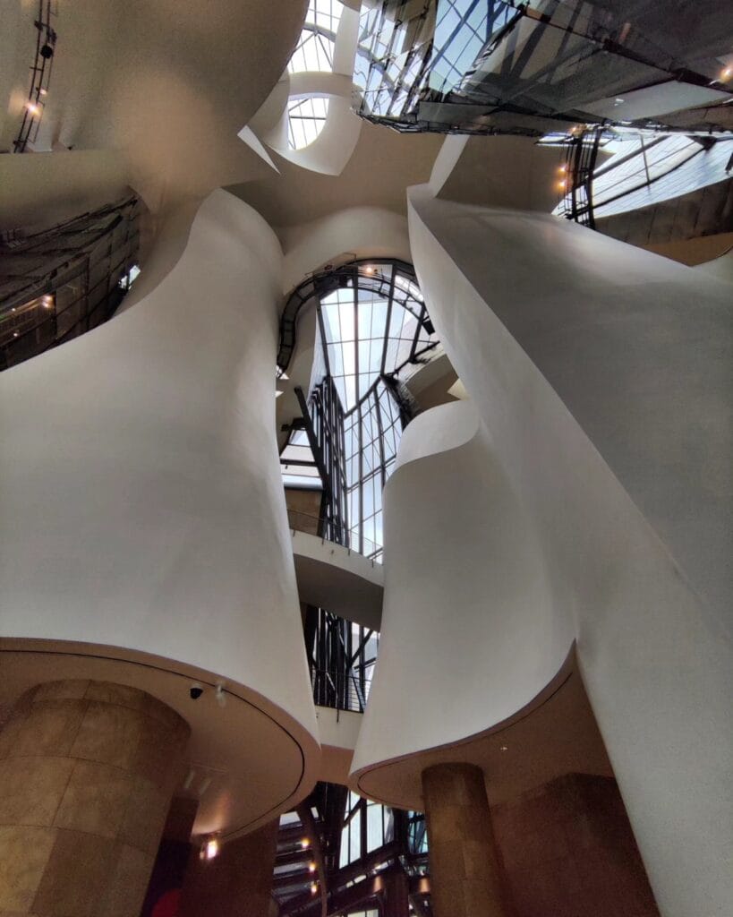 The swirling white atrium inside the Guggenheim Museum Bilbao