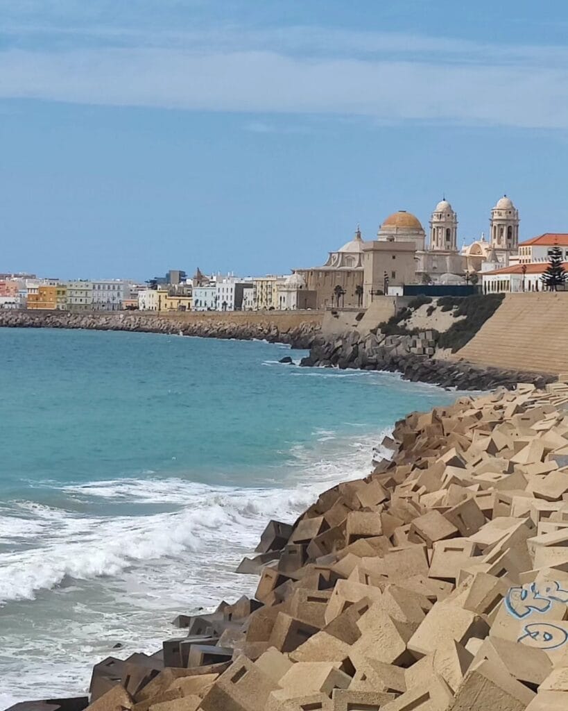 Cadiz old-town skyline with the cathedral dome rising over a turquoise sea