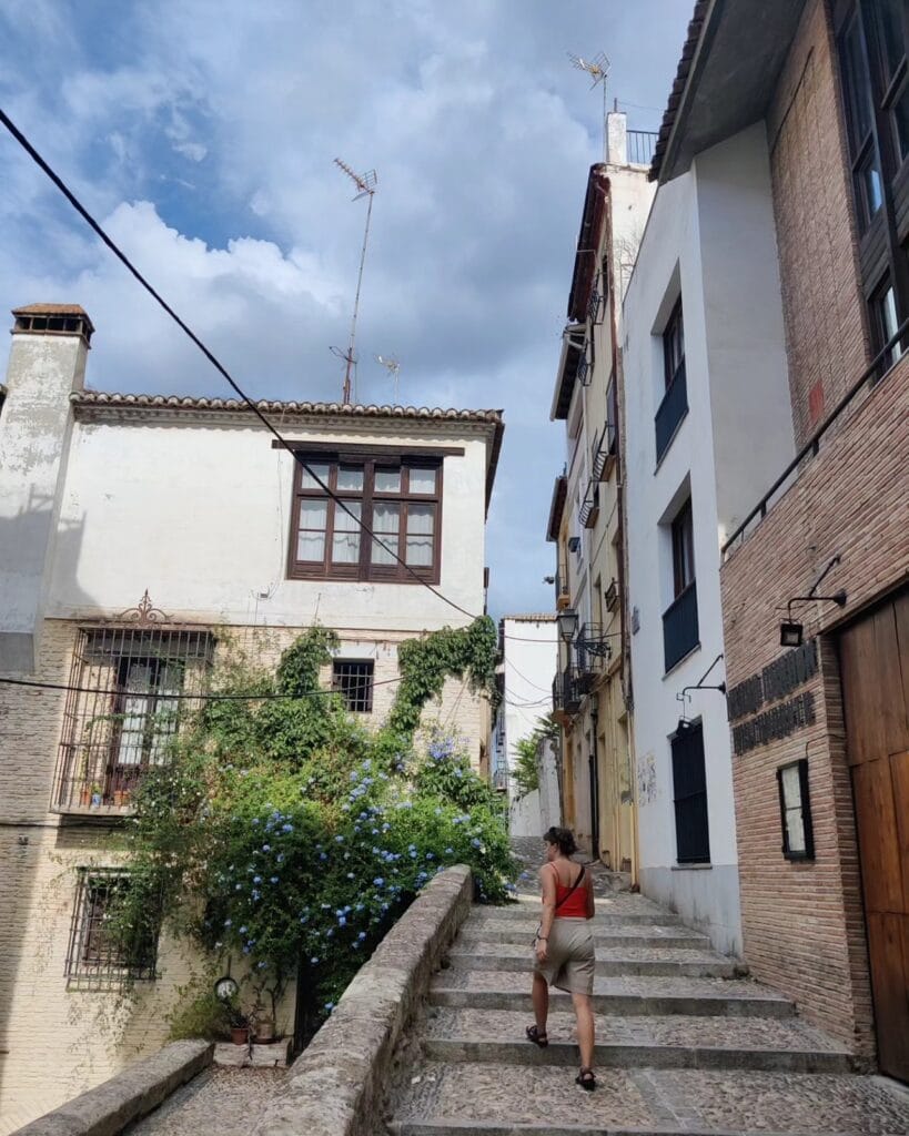 Flowered whitewashed steps climbing the Albaicin, Granada