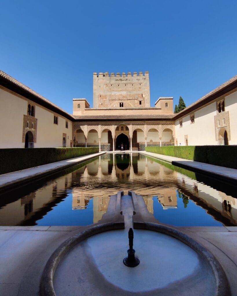 The Comares Tower mirrored in the reflecting pool of the Court of the Myrtles, Alhambra