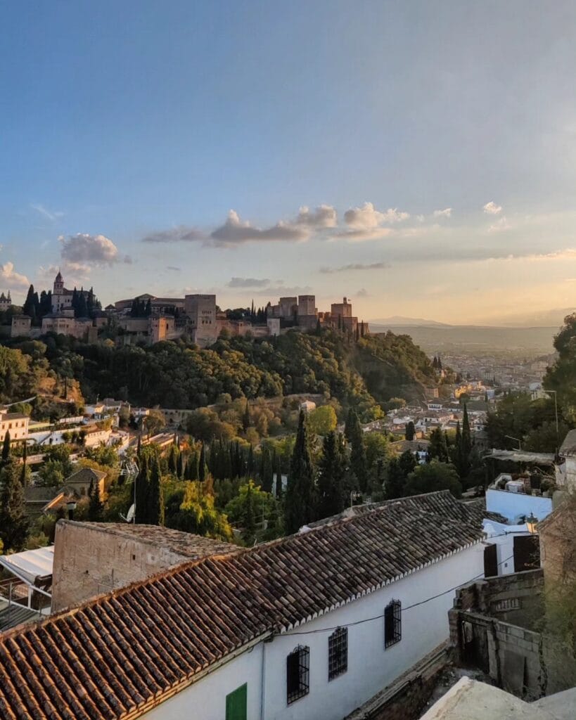 The Alhambra glowing at sunset seen from Mirador de San Nicolas, Granada