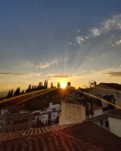 Sunburst sunset over the rooftops of the Albaicin in Granada