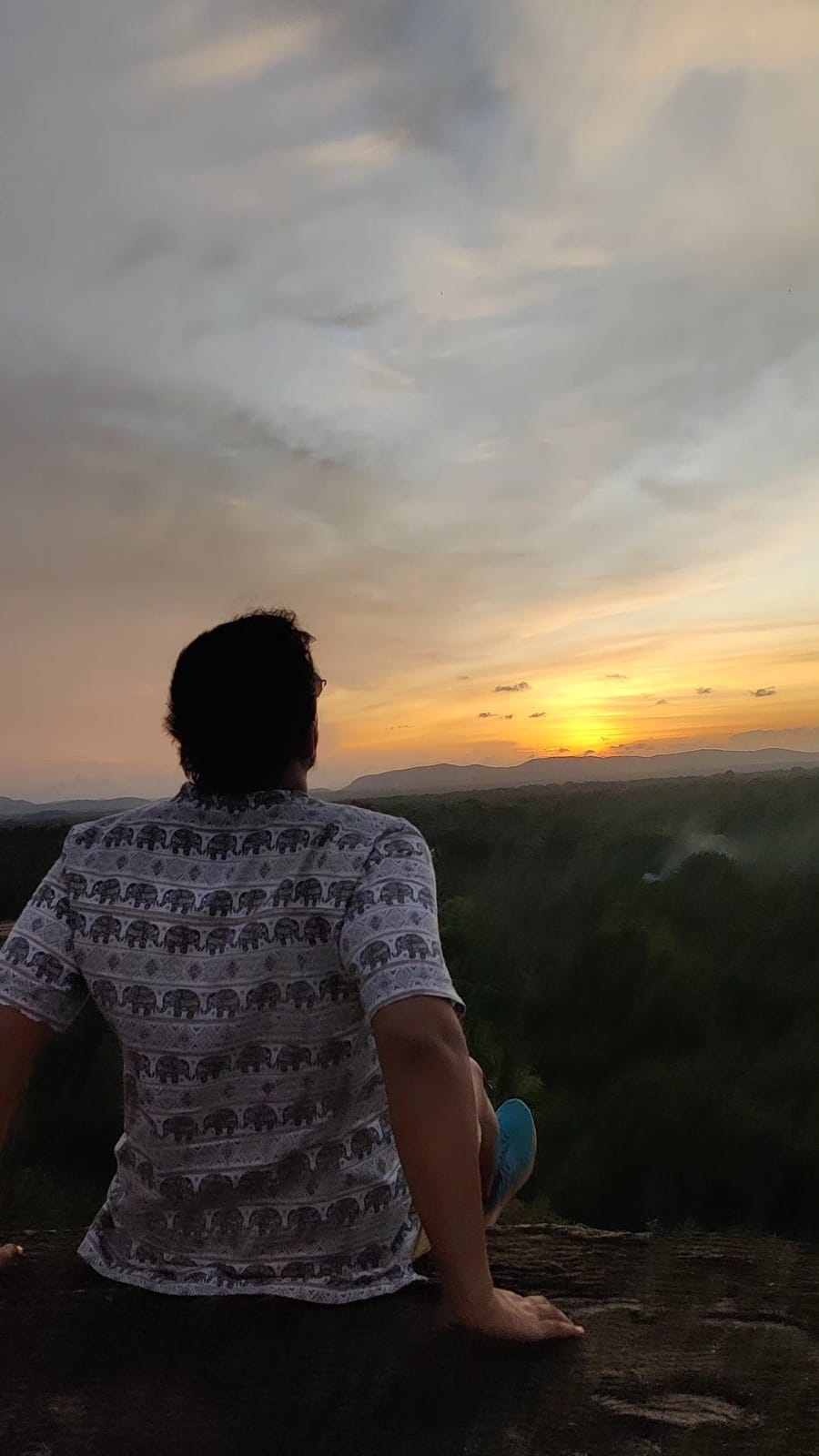 Watching the sunset over the jungle from a rock near the Sigiriya market