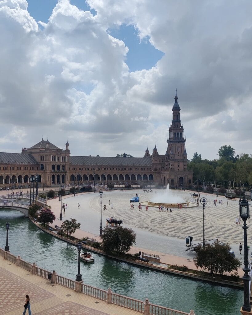 The half-moon facade and canal of the Plaza de Espana in Seville