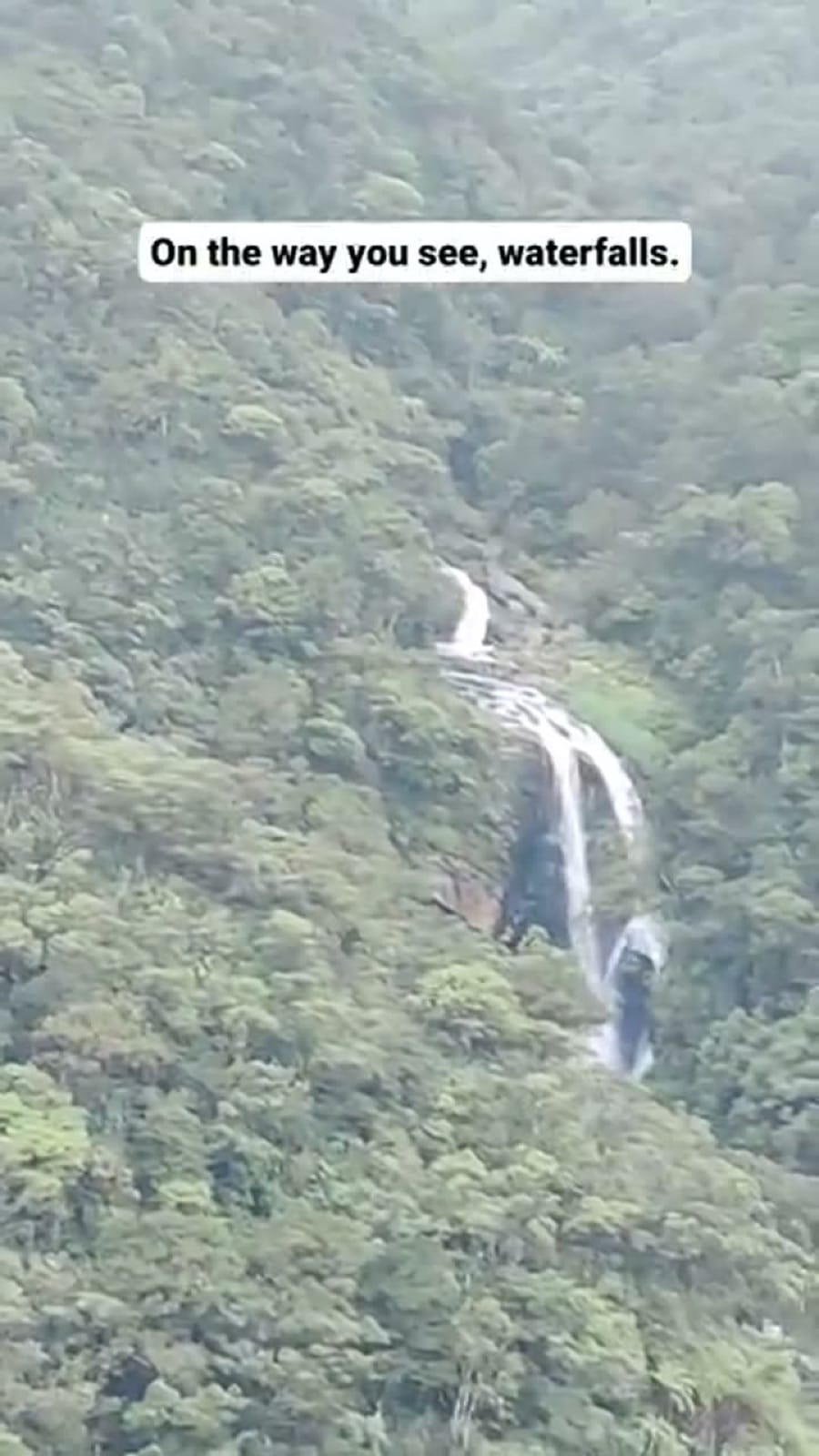 Waterfall seen from the window of the hill-country train
