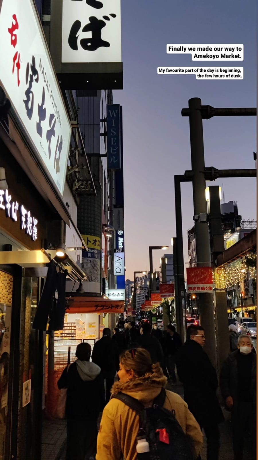 Evening at Ameyoko Market with crowds and Japanese signage.