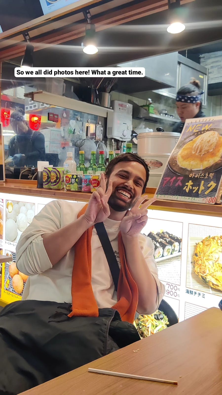 Vipul peace signs at takoyaki restaurant.