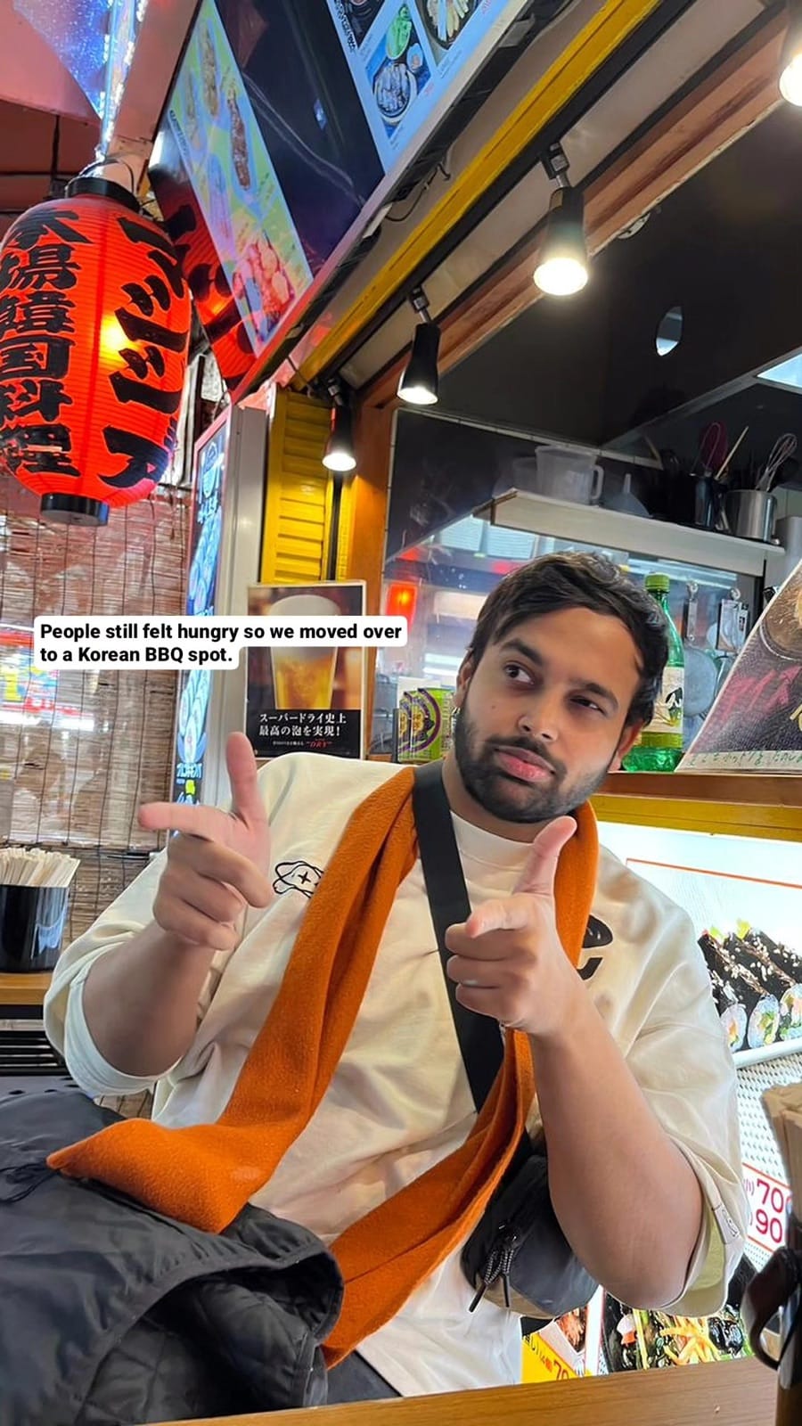 Vipul giving thumbs up at Korean BBQ entrance.