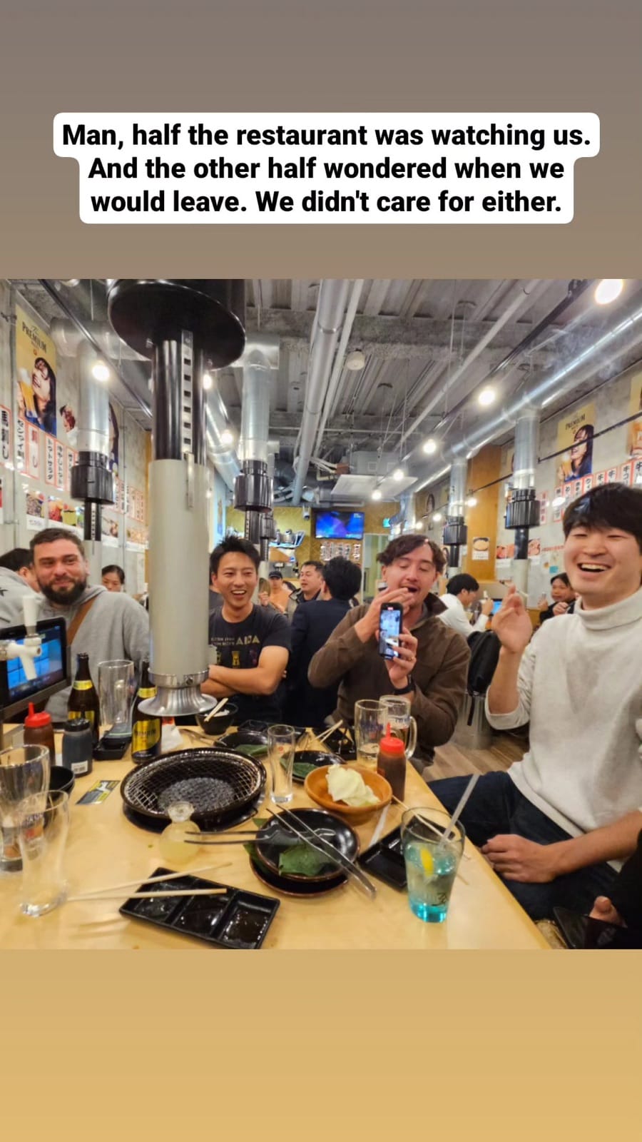 Group having fun at Korean BBQ restaurant.