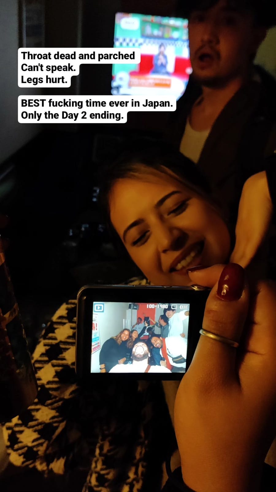 Karaoke recording on phone during late-night session.