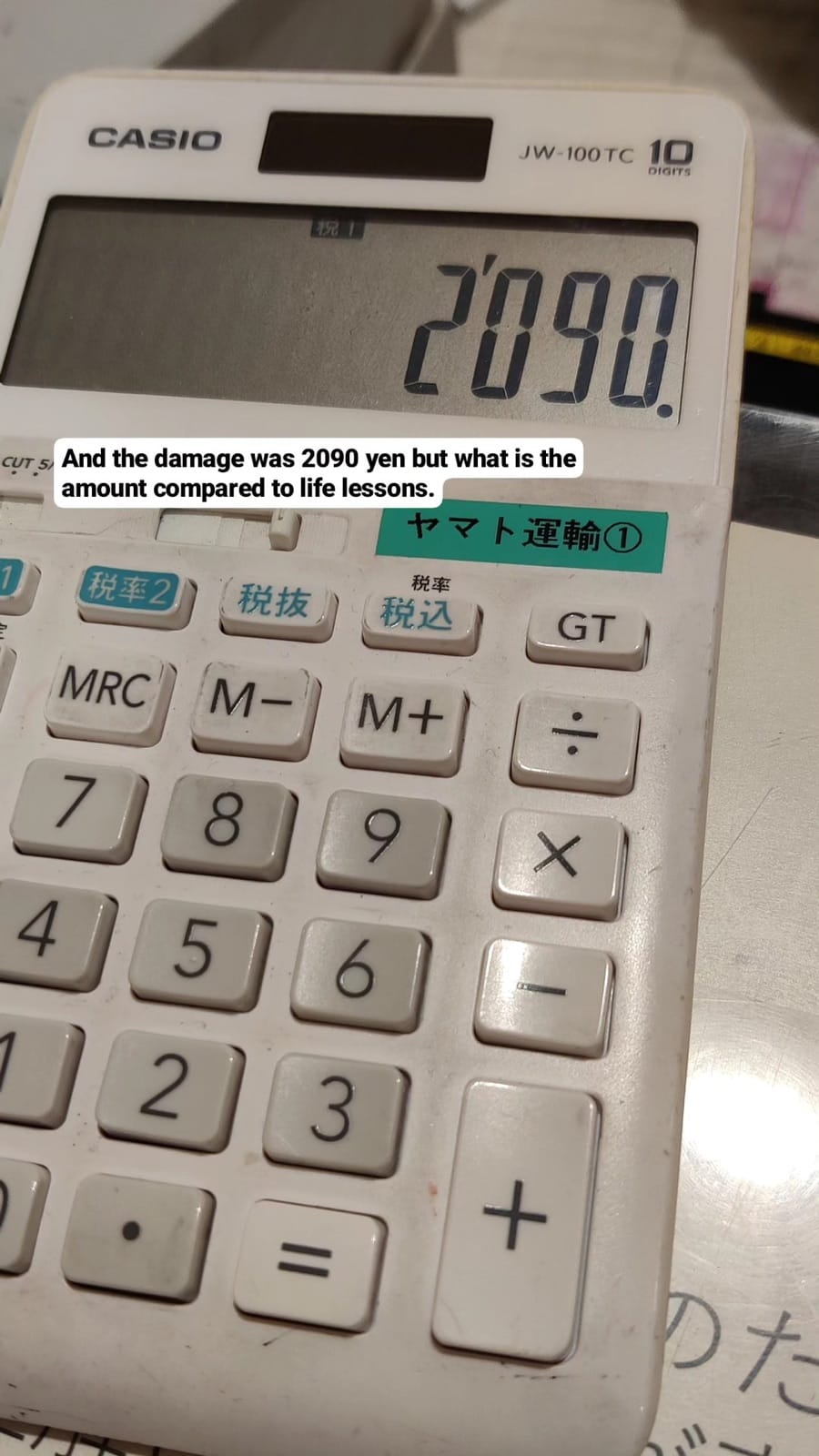 Calculator at the Yamato Transport counter showing 2,090 yen, the cost of fixing the luggage mix-up