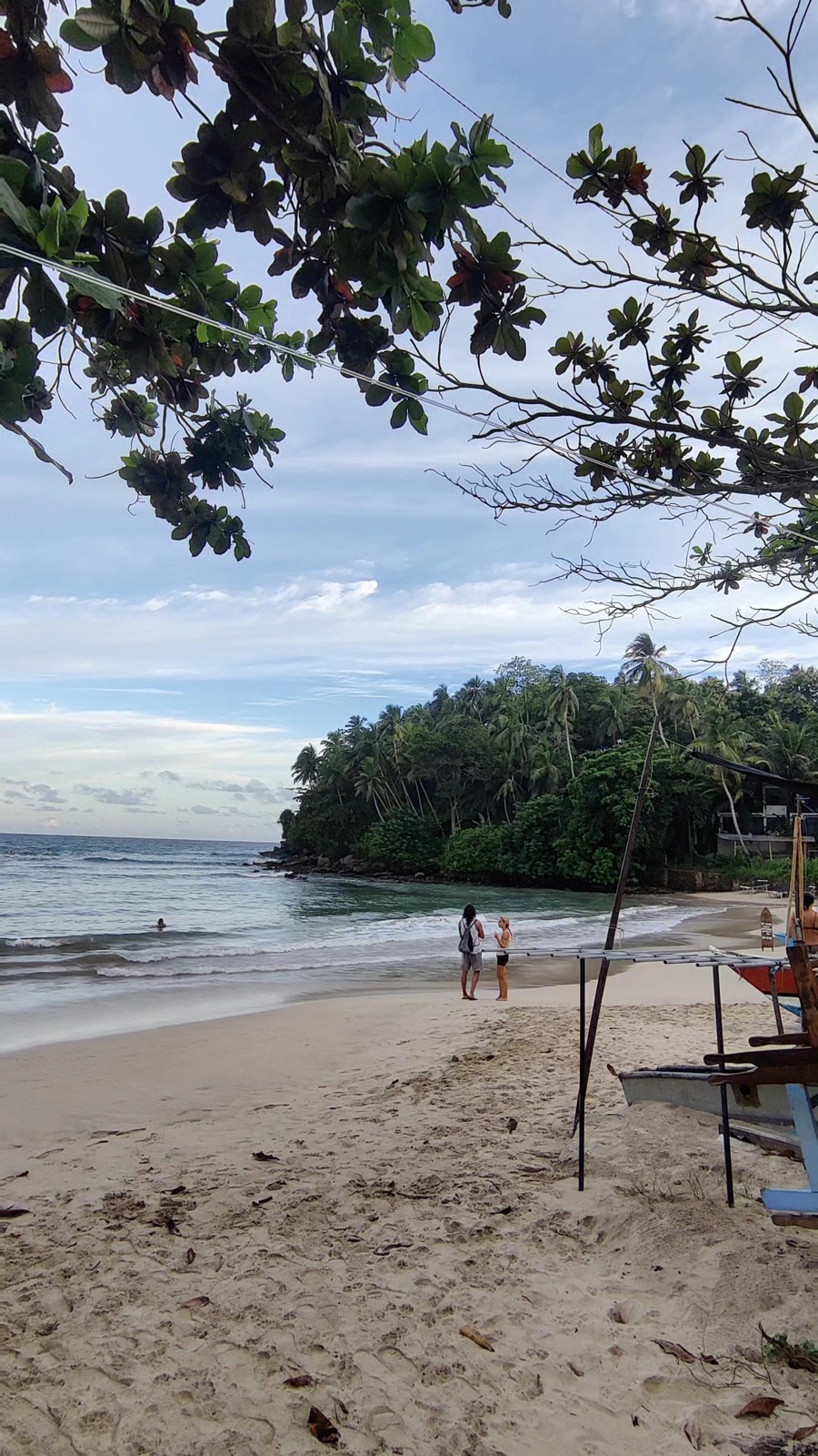 The horseshoe bay of Hiriketiya with jungle on one side and surf on the other