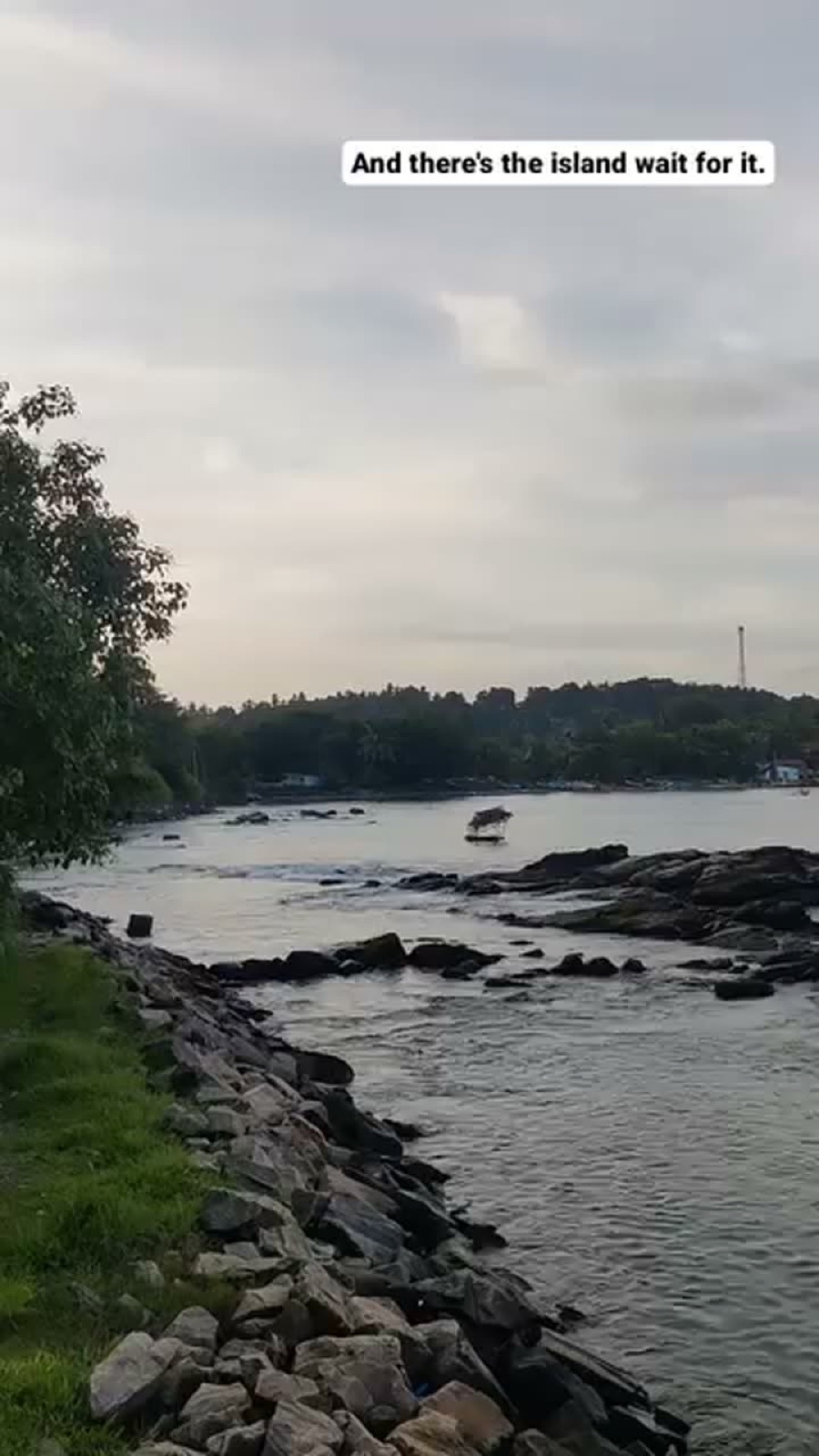 Story frame of rocks and water: there's the island, wait for it