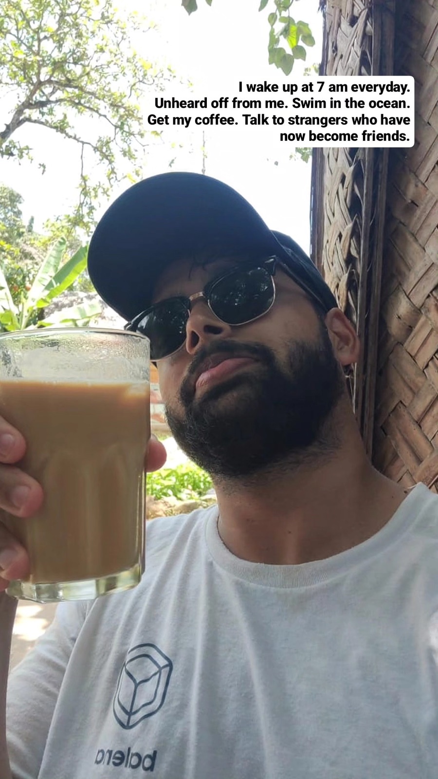 Selfie with an iced coffee: up at 7 am every day, swim in the ocean, talk to strangers